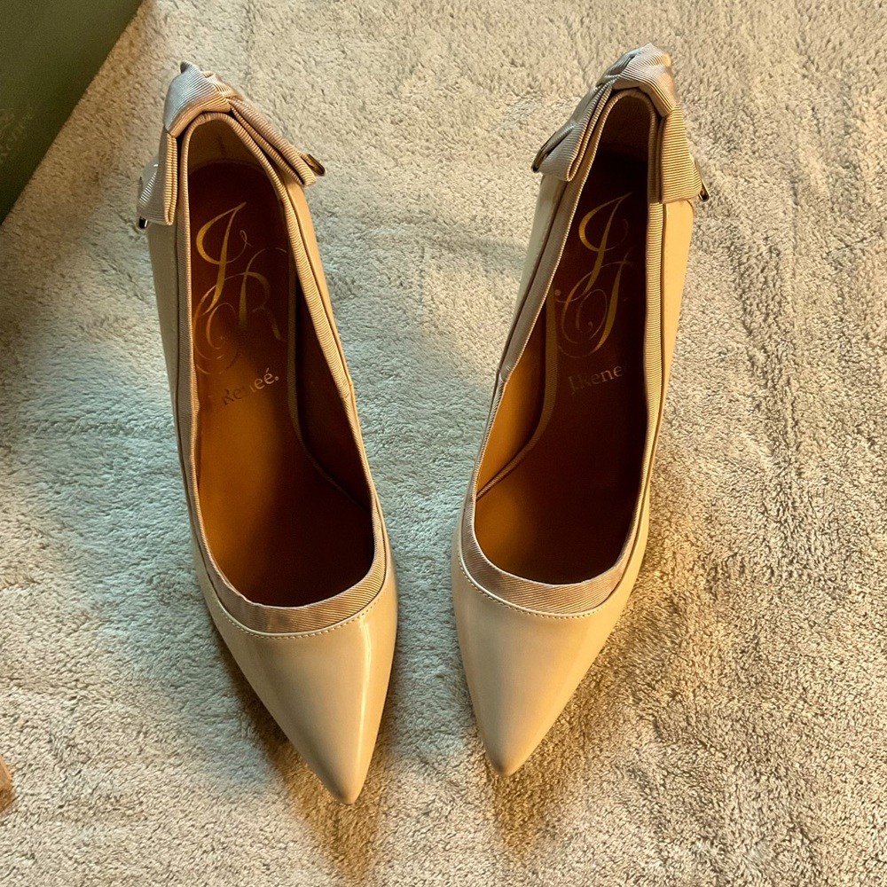 Nude patent leather heels with beautiful detail fabric bow in back